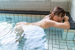 1girl ass back black_hair completely_nude flat_chest from_side indoors japanese_(nationality) looking_at_viewer monami_suzu nude partially_submerged photo_(medium) poolside real_life short_hair water watermark wet