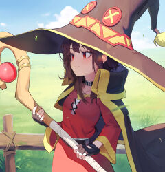 Rule 34 | 1girl, alaskastomatoez, black cape, black gloves, black hair, cape, closed mouth, day, dress, fence, fingerless gloves, gloves, grass, hat, highres, holding, holding staff, kono subarashii sekai ni shukufuku wo!, long hair, mage staff, megumin, off-shoulder dress, off shoulder, outdoors, red dress, red eyes, sky, solo, staff, witch hat, wooden fence