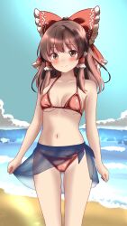 1girl absurdres alternate_costume beach bikini blush bow breasts breasts_apart brown_eyes brown_hair burukyu closed_mouth cloud collarbone commentary english_commentary frilled_bow frilled_hair_tubes frills gluteal_fold hair_bow hair_tubes hakurei_reimu highres long_hair looking_at_viewer navel ocean outdoors paid_reward_available red_bikini red_bow sarong smile solo stomach swimsuit touhou