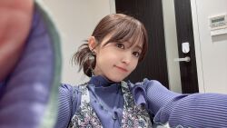 1girl aida_rikako brown_hair dress earrings head_tilt highres indoors jewelry looking_at_viewer photo_(medium) real_life selfie standing voice_actor