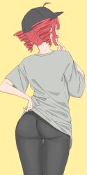 1girl ahoge ass ass_focus back baseball_cap black_hat black_pants drill_hair finger_to_own_chin from_behind grey_shirt hand_on_own_hip hat high_re highres kasane_teto leggings override_(synthesizer_v) pants red_hair shirt simple_background solo synthesizer_v t-shirt twin_drills utau white_shirt yellow_background