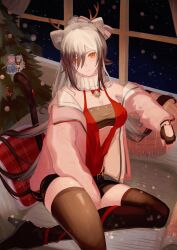 1girl absurdres animal_ears antlers aoi_tooru arknights bandeau bare_shoulders bell black_bandeau black_gloves black_shorts black_thighhighs bow breasts cat_ears ceylon_(arknights) character_doll christmas closed_mouth doll dress fake_antlers fingerless_gloves gloves grey_hair hair_between_eyes hair_bow hair_bun highres horns indoors jacket long_hair long_sleeves looking_at_viewer off_shoulder official_alternate_costume open_clothes open_jacket pink_jacket ponytail red_dress schwarz_(arknights) schwarz_(presents)_(arknights) short_shorts shorts sitting snowing solo thighhighs yellow_eyes