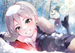 1girl black_boots blurry blush boots commentary_request depth_of_field earrings foot_up fur-trimmed_jacket fur_trim grey_eyes grin highres idolmaster idolmaster_cinderella_girls jacket jewelry looking_at_viewer lying on_stomach outdoors selfie shiomi_syuko short_hair smile snow snow_on_head snowman solo tialas white_hair