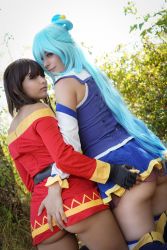 Rule 34 | 2girls, absurdres, aqua (konosuba), aqua (konosuba) (cosplay), ass, blue hair, brown hair, cosplay, day, female focus, gunaretta, highres, kono subarashii sekai ni shukufuku wo!, long hair, lysande, megumin, megumin (cosplay), multiple girls, outdoors, photo (medium), short hair, tagme, yuri