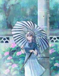 1girl artist_name black_hair commentary_request flower green_shirt hair_ornament hairband hairclip haruna_(kancolle) haruna_(rainy_season)_(kancolle) holding holding_umbrella kantai_collection long_hair looking_to_the_side official_alternate_costume outdoors rain shirt short_sleeves skirt solo striped_umbrella two-tone_umbrella umbrella white_hairband white_skirt wss_(nicoseiga19993411)