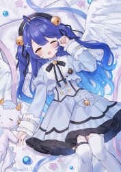 ahoge amamiya_kokoro angel_wings animal bell belt beret blue_hair blush bow commentary dress fang hair_bell hair_between_eyes hair_ornament hair_ribbon hand_up hat highres holding_hands jingle_bell knees_together_feet_apart long_sleeves looking_at_viewer lying meibi_1 nijisanji on_back open_mouth pillow ribbon signature skin_fang sleepy thigh_belt thigh_strap thighhighs two_side_up virtual_youtuber white_thighhighs wings wrist_cuffs x_hair_ornament yellow_eyes