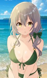 1girl bare_arms bare_shoulders beach bikini bow breasts collarbone day dot_nose feet_out_of_frame female_focus green_bikini grey_hair hair_between_eyes hair_bow himahari_neru koisuru_asteroid large_breasts long_hair looking_at_viewer morino_mari navel open_mouth outdoors solo standing swimsuit water yellow_eyes