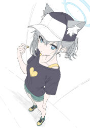 1girl animal_ear_fluff animal_ears baseball_cap black_shirt blue_archive blue_eyes blue_halo blush closed_mouth earphones ears_through_headwear extra_ears from_above green_shoes green_shorts grey_hair halo hat heart heart_print highres holding holding_earphones looking_at_viewer mismatched_pupils shiroko_(blue_archive) shirt shoes short_hair short_sleeves shorts sneakers solo t1kosewad wireless_earphones wolf_ears wolf_girl