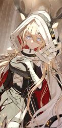 1girl animal_ears antlers antlers_through_hood arknights blonde_hair blue_eyes breast_suppress cape closed_mouth commentary corrupted_twitter_file cowboy_shot ears_through_hood embers hair_between_eyes hair_ornament highres hood hood_up hooded_cape horns jewelry light_smile long_bangs long_hair looking_at_viewer red_cape rei_yagami ring solo standing strap two-sided_cape two-sided_fabric viviana_(arknights) white_cape x_hair_ornament