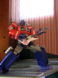 figure guitar guitar_hero instrument optimus_prime photo_(medium) transformers transformers:_generation_1
