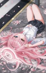 1girl absurdres black_skirt blue_archive blue_eyes blush cherry_blossoms chii_(k_ung) closed_mouth hair_between_eyes heterochromia highres hoshino_(blue_archive) long_hair looking_at_viewer lying on_back shirt sidelocks skirt smile solo white_shirt yellow_eyes