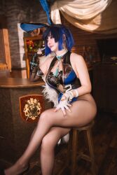 1girl animal_ears asian blue_hair blue_leotard breasts brooch chair cosplay counter crossed_legs earrings fake_animal_ears fingerless_gloves genshin_impact gloves high_heels indoors japanese_(nationality) jewelry leotard nuenue_249 pantyhose plaque rabbit_ears real_life short_hair sitting solo solo_focus stool yelan_(genshin_impact)
