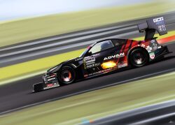 1boy absurdres advan car fire from_side highres motion_blur motor_vehicle nissan nissan_silvia nissan_silvia_s15 race_vehicle racecar real_life shadow silenxe spoiler_(automobile) sponsor suzuki_tomohiko vehicle_focus world_time_attack_challenge