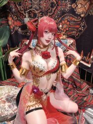 1girl belly_dancer breasts cleavage cosplay flower heterochromia hololive houshou_marine indian_clothes japanese_(nationality) kneeling kusa_cos large_breasts real_life red_hair rose twintails virtual_youtuber