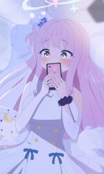 1girl absurdres angel_wings blue_archive blue_ribbon blush breasts commentary_request covered_mouth dress fortysansan hair_bun halo highres holding holding_phone large_breasts long_hair mika_(blue_archive) multicolored_halo on_bed phone pillow pink_hair ribbon sleeveless sleeveless_dress solo white_dress wings yellow_eyes