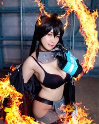 1girl black_bra bra breasts cosplay en&#039;en_no_shouboutai female_focus fire highres large_breasts long_hair looking_at_viewer model partially_undressed photo_(medium) shibuya_kaho smile solo tamaki_kotatsu tamaki_kotatsu_(cosplay) twintails underwear wig