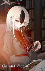 1girl absurdres armchair ascot black_hair black_horns blue_archive book bookshelf bright_pupils chain chair character_name closed_mouth commentary demon_horns double-parted_bangs dress ear_piercing frilled_dress frilled_sleeves frills glasses grey_dress grey_halo hair_between_eyes halo highres hit_by_hit holding holding_removed_eyewear horns kayoko_(blue_archive) long_hair long_sleeves looking_down multicolored_hair open_book piercing red_ascot red_eyes round_eyewear sitting solo two-tone_hair unworn_eyewear white_hair white_pupils