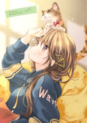 Rule 34 | 1girl, animal, animal on head, arm up, blue hoodie, blurry, blurry background, blush, book, brown eyes, brown hair, cat, closed mouth, commentary request, depth of field, drawstring, hair between eyes, hair ornament, hair over shoulder, hood, hood down, hoodie, kuga tsukasa, long hair, low twintails, on head, open book, original, signature, smile, solo, twintails, twitter username, upper body, watermark, web address