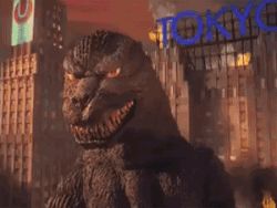 animated animated_gif building city destruction dinosaur fabulous fire giant giant_monster godzilla godzilla_(series) japan kaiju lowres monster mutant no_humans sea_monster skyscraper sparks sunglasses tail toho tokyo_(city) what