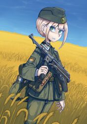 1girl ammunition_pouch arm_at_side backpack bag belt belt_pouch blonde_hair blue_skirt canteen clear_sky commentary dutch_angle english_commentary erica_(naze1940) garrison_cap green_bag green_belt green_eyes green_hat green_jacket green_pants gun gun_sling hat highres holding holding_gun holding_weapon jacket jewelry light_smile looking_at_viewer looking_to_the_side military military_jacket military_uniform mp40 nose original pants parted_lips patch pouch ring shaded_face short_hair short_hair_with_long_locks shoulder_patch sidelocks skirt sky smile standing submachine_gun translated ukraine upturned_eyes very_short_hair weapon wheat wheat_field world_war_ii