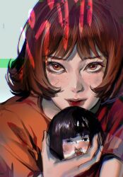 1girl black_hair bob_cut brown_eyes brown_hair chinese_commentary closed_mouth commentary_request doll elicooc eyelashes freckles highres holding kon_satoshi_(director) lipstick looking_at_viewer makeup nose paprika paprika_(character) red_lips red_shirt shirt short_hair short_sleeves solo t-shirt upper_body