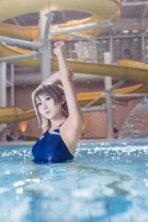 1girl armpits arms_up blue_eyes blurry blurry_background cosplay cosplay_photo grey_hair indoors japanese_(nationality) looking_at_viewer love_live! love_live!_sunshine!! mi_yan_0728 one-piece_swimsuit partially_submerged photo_(medium) pool short_hair solo swimsuit watanabe_you water