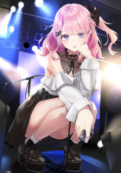 1girl bare_legs black_skirt braid cover cover_page full_body hair_ornament hairclip hand_on_own_cheek hand_on_own_face highres holding holding_microphone lace_shirt microphone mirea nerina_(overwrite) novel_cover off-shoulder_shirt off_shoulder official_art overwrite_(novel) pink_hair platform_heels purple_eyes second-party_source shirt side_ponytail skirt smile solo speaker spotlight squatting stage