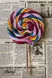 absurdres candy food food_focus highres julia_stankevych lollipop newspaper no_humans oil_painting_(medium) original painting_(medium) photo_(medium) realistic signature still_life swirl_lollipop traditional_media wall_of_text