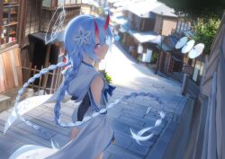 1girl absurdres architecture blue_archive blue_hair blue_halo blurry blurry_background blush braid brick_floor chise_(blue_archive) commentary day detached_sleeves east_asian_architecture feet_out_of_frame floating_hair flower from_behind gaoqiaoyuyin_takahashi hair_between_eyes hair_flower hair_ornament halo highres horns japanese_clothes long_hair long_sleeves looking_at_viewer looking_back nontraditional_miko oni outdoors pink_eyes red_horns sailor_collar school_uniform serafuku skin-covered_horns solo standing twin_braids very_long_hair white_sailor_collar wide_sleeves