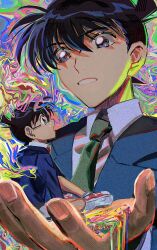 2boys abstract_background black_hair blue_eyes blue_jacket dual_persona edogawa_conan green_necktie highres in_palm jacket kudou_shin&#039;ichi looking_at_another meitantei_conan mini_person miniboy multiple_boys necktie segami shirt short_hair white_shirt