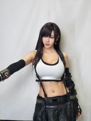 1girl bare_shoulders black_gloves black_hair black_skirt black_thighhighs breasts female_focus final_fantasy final_fantasy_vii final_fantasy_vii_remake fingerless_gloves gloves highres ja10888 korean_(nationality) large_breasts long_hair midriff navel red_eyes skirt solo square_enix suspenders tank_top thighhighs tifa_lockhart tifa_lockhart_(cosplay) white_tank_top