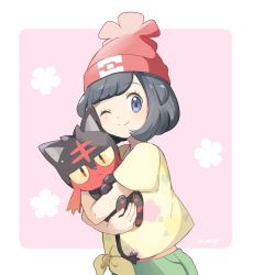 1girl animal_hands artist_name bad_id bad_pixiv_id beanie black_hair blue_eyes blush border closed_mouth colored_sclera creatures_(company) female_focus floral_print game_freak gen_7_pokemon green_shorts happy hat holding holding_pokemon hug jitome light_blush litten looking_at_viewer mei_(maysroom) midriff_peek nintendo one_eye_closed pawpads pink_background poke_ball_theme pokemon pokemon_(creature) pokemon_sm red_eyes red_headwear selene_(pokemon) shirt short_hair short_sleeves shorts signature simple_background smile standing tied_shirt white_border wink yellow_sclera yellow_shirt