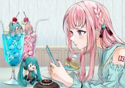 1girl alternate_costume aqua_dress aqua_eyes aqua_nails black_ribbon blush braid breasts character_doll character_name cherry collar commentary cup dessert detached_sleeves doll dress drinking_glass drinking_straw ear_piercing earrings eyelashes food frilled_collar frills from_side fruit hair_flowing_over hair_ornament hair_ribbon hatsune_miku heart heart_hair_ornament highres holding holding_phone hurricane_glass ice ice_cube indoors jewelry leaning_forward long_hair long_sidelocks long_sleeves looking_at_object macaron medium_breasts megurine_luka necklace phone piercing pink_hair plate ramika_(ramika0606) red_ribbon ribbon ring ring_necklace shoulder_tattoo side_braid sidelocks sleeveless sleeveless_dress solo stud_earrings taking_picture tattoo two-sided_ribbon vocaloid whipped_cream