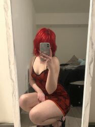 1girl breasts dress high_heels holding holding_phone iloveballs666 mirror_selfie nail_polish phone photo_(medium) real_life red_dress red_hair selfie short_dress short_hair small_breasts solo squatting thick_thighs thighs