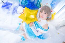 1girl bblush blue_eyes brown_hair cosplay cosplay_photo grey_hair koi_ni_naritai_aquarium love_live! photo_(medium) short_hair skirt smile solo thighs tiara watanabe_you
