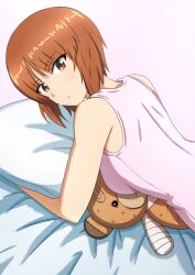 alternate_costume bandages bandaid bed_sheet boko_(girls_und_panzer) breasts brown_eyes brown_hair crushing frown girls_und_panzer highres looking_at_viewer nishizumi_miho omachi_(slabco) pillow pink_shirt shirt short_hair sleeveless sleeveless_shirt stuffed_animal stuffed_toy sweat sweatdrop tank_top teddy_bear