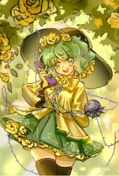 1girl arm_behind_back black_hat black_thighhighs blouse bow bowtie buttons commentary cowboy_shot diamond_button floral_print floral_print_skirt flower flower_underskirt frilled_sleeves frills green_eyes green_hair green_skirt hair_flower hair_ornament hand_up hat hat_flower head_tilt highres holding holding_phone koishi_day komeiji_koishi leaf looking_at_viewer open_mouth phone rose rose_print shirt short_hair shouxishao_jiuyuan skindentation skirt solo standing teeth thighhighs thorns touhou upper_teeth_only yellow_bow yellow_bowtie yellow_flower yellow_rose yellow_shirt