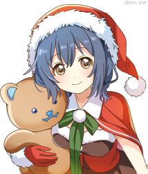 1girl blue_hair breasts brown_dress brown_eyes capelet closed_mouth dress fur-trimmed_dress fur-trimmed_gloves fur-trimmed_headwear fur_trim furutani_himawari gloves hat highres holding_teddy_bear looking_at_viewer medium_breasts medium_hair nnn_yryr red_capelet red_gloves red_hat santa_hat simple_background smile solo stuffed_animal stuffed_toy teddy_bear twitter_username upper_body white_background yuru_yuri