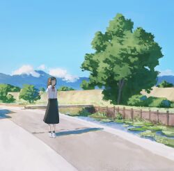1girl arms_behind_back black_skirt blue_sky brown_eyes brown_hair bush cloud day fjsmu highres long_hair mountain neck_ribbon original outdoors red_ribbon ribbon road shadow shirt shoes skirt sky solo tree white_shirt white_shoes