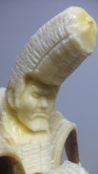 Rule 34 | 1boy, banana, delinquent, epic, food, food art (medium), food focus, frown, fruit, grey background, highres, male focus, manly, original, photo (medium), pompadour, sculpture, simple background, solo, suu (banana), unconventional media, y yamaden