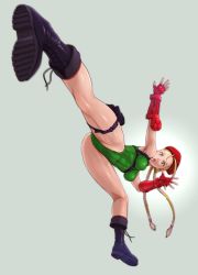 1girl :o ahoge bare_shoulders beret blonde_hair blue_eyes boots braid breasts cameltoe cammy_white covered_navel female_focus fingerless_gloves flying_kick foreshortening gauntlets gloves green_background green_leotard grey_background harness hat highleg highleg_leotard highres holster huge_ahoge kicking leotard lips long_hair medium_breasts nigou shiny_clothes shiny_skin solo street_fighter street_fighter_v thigh_holster thigh_strap toned twin_braids