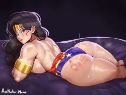 1girl absurdres aestheticc-meme armlet ass bare_shoulders black_hair blue_eyes breasts closed_mouth dc_comics highres jewelry large_breasts leotard leotard_pull lips looking_at_viewer lying muscular muscular_female on_stomach red_lips sideboob slap_mark smile solo spanked tiara wonder_woman