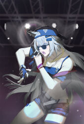 1girl absurdres alternate_costume animal_ears arknights baseball_cap black_gloves black_shorts black_tank_top chain cowboy_shot fang fingerless_gloves gekeluoyouka gloves gold_chain grey_eyes grey_hair hair_between_eyes hair_ornament hairclip hat highres holding holding_microphone indoors lappland_(arknights) long_hair material_growth microphone open_mouth oripathy_lesion_(arknights) scar scar_across_eye scar_on_face short_shorts shorts single_fingerless_glove skin_fang solo tank_top tinted_eyewear wolf_ears wolf_girl