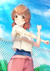 1girl ahoge brown_eyes brown_hair chain-link_fence cross-body_stretch fence gakuen_idolmaster hanami_ume highres idolmaster looking_at_viewer novady pants red_pants shirt short_sleeves smile solo upper_body white_shirt