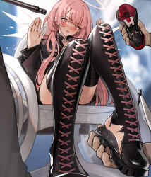 1girl 2others arknights black_boots black_jacket black_shoes black_shorts blush boots detached_wings halo hands_up holding_shoe jacket lemuen_(arknights) long_hair multiple_others open_mouth pink_hair pink_halo shoes shorts sitting torn_footwear unworn_shoes v-shaped_eyebrows wheelchair wings xssh
