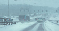 absurdres car day highres lamppost motor_vehicle no_humans outdoors power_lines road road_sign sign simon_stalenhag sky snow swedish_machines tree
