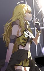 1girl absurdres ahoge black_gloves black_overskirt blonde_hair bracelet breasts closed_mouth cowboy_shot cropped_vest fingerless_gloves from_side fur_collar gloves green_eyes hand_up headset highres hoshii_miki hoshii_miki_(light_of_wishes) idolmaster idolmaster_(classic) idolmaster_million_live! idolmaster_million_live!_theater_days jewelry katsu_(kana) long_hair midriff navel shorts solo stage standing vest yellow_shorts yellow_vest