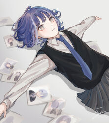 1girl black_sweater_vest blue_hair blue_necktie bright_pupils collared_shirt commentary_request grey_eyes grey_skirt highres lying medium_hair multicolored_hair necktie original photo_(object) pleated_skirt shirt signature skirt solo streaked_hair sweater_vest two-tone_hair white_hair white_pupils white_shirt yoruse