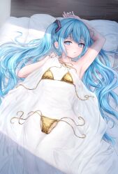 1girl alternate_costume armpits bed_sheet bikini blue_eyes blue_hair blue_nails blush closed_mouth commentary covering_privates fingernails gold_bikini hashtag-only_commentary hatsune_miku highres kotone_aguli long_hair looking_at_viewer lying nail_polish nude_cover on_back pillow side-tie_bikini_bottom sidelocks small_sweatdrop solo swimsuit twintails unworn_bikini unworn_bikini_bottom unworn_bikini_top very_long_hair vocaloid