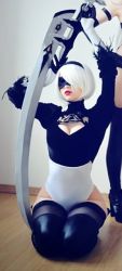 Rule 34 | 2girls, breasts, cleavage, cosplay, floor, hair ornament, kneeling, leotard, lipstick, multiple girls, nier (series), nier:automata, photo (medium), short hair, sitting, sword, thighhighs, weapon, white hair, 2b (nier:automata), 2b (nier:automata) (cosplay), yuzu pyon